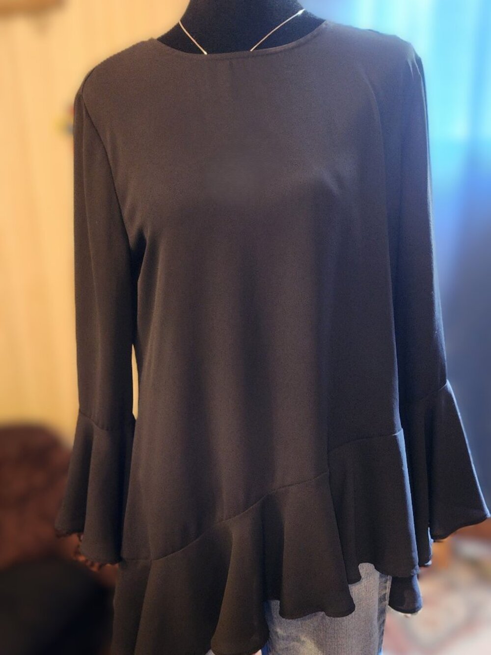 Chicos Black Asymmetrical Hem blouse with bell sleeves Size 0